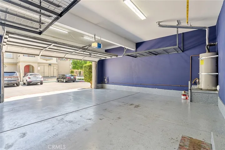 Garage, with plenty of storage and upgraded flooring.