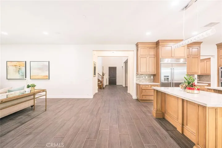 The living room flows seamlessly into the kitchen with an open-concept design.
