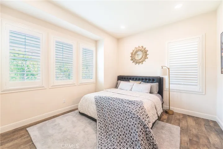 There’s a first-floor bedroom with its own private bathroom, perfect for a mother-in-law suite or guests, offering both privacy and convenience.