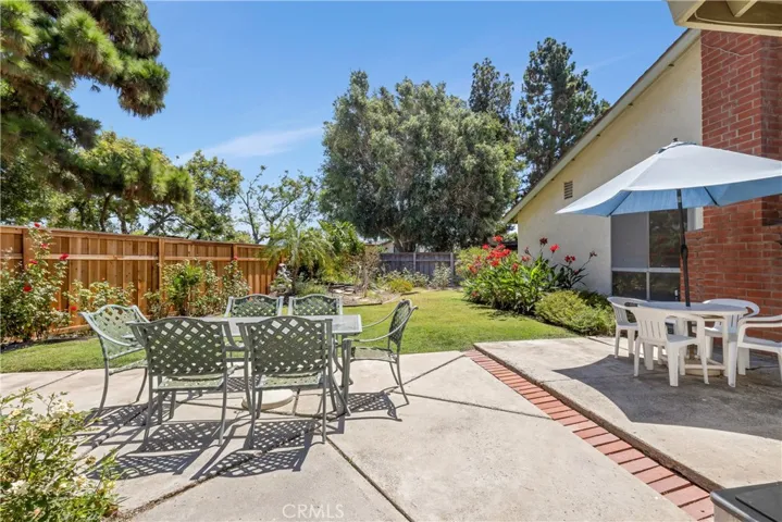 With over 9,000SF of lot, the backyard is well manicured with vegetable beds, fruit bearing trees, mature bushes, built-in fire pit and so much more! Pool sized lot!!