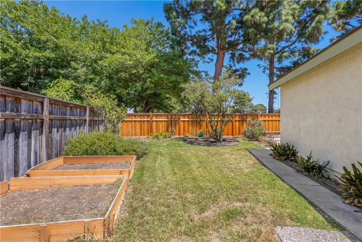 With over 9,000SF of lot, the backyard is well manicured with vegetable beds, fruit bearing trees, mature bushes, built-in fire pit and so much more! Pool sized lot!!