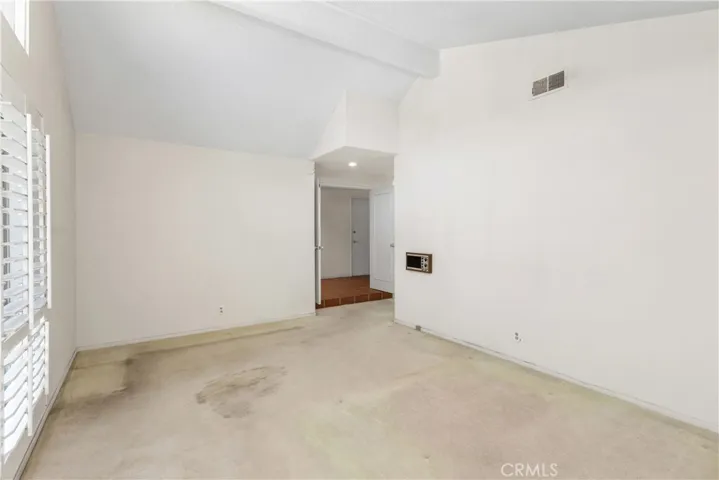 Owner's suite has vaulted ceilings, mirrored wardrobe, and en-suite.