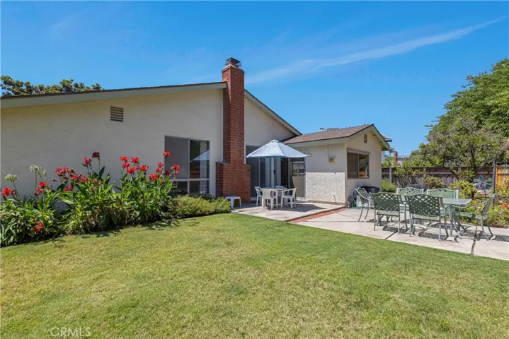With over 9,000SF of lot, the backyard is well manicured with vegetable beds, fruit bearing trees, mature bushes, built-in fire pit and so much more! Pool sized lot!!