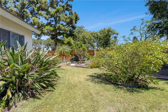 With over 9,000SF of lot, the backyard is well manicured with vegetable beds, fruit bearing trees, mature bushes, built-in fire pit and so much more! Pool sized lot!!