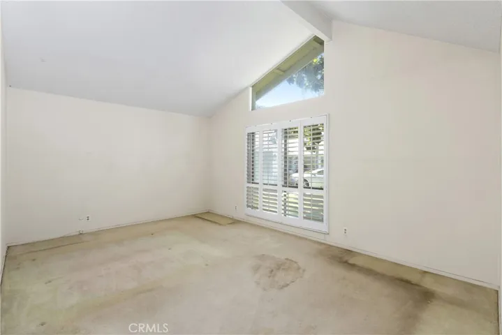 Owner's suite has vaulted ceilings, mirrored wardrobe, and en-suite.