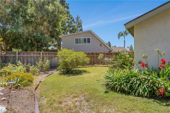 With over 9,000SF of lot, the backyard is well manicured with vegetable beds, fruit bearing trees, mature bushes, built-in fire pit and so much more! Pool sized lot!!