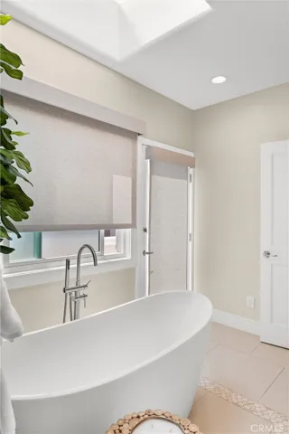 The spa-inspired bath overhead skylight providing the perfect place to unwind after a long day.