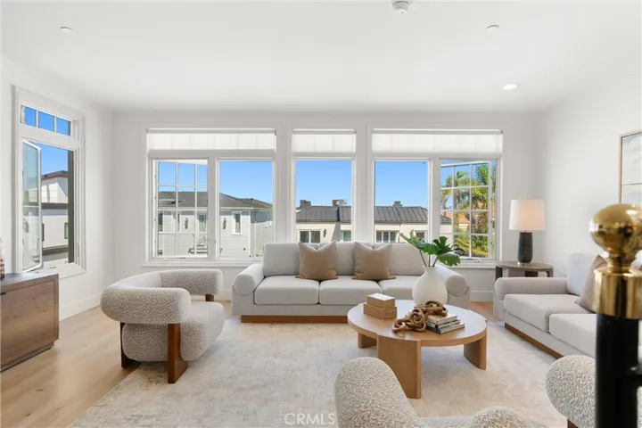 Open and airy seating area offers a stylish retreat framed by abundant natural light and coastal charm