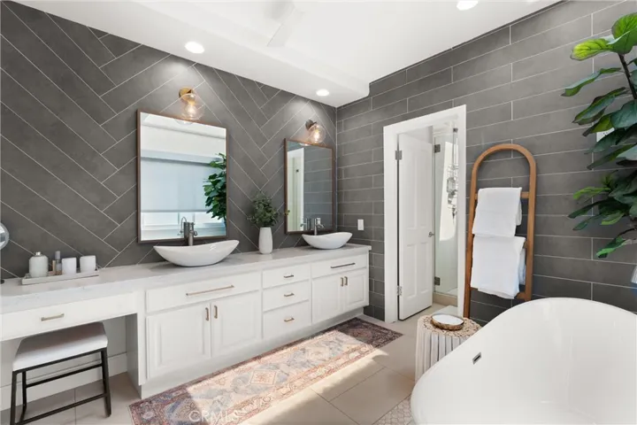 Flooded with natural light, this luxurious bathroom offers a tranquil retreat.
