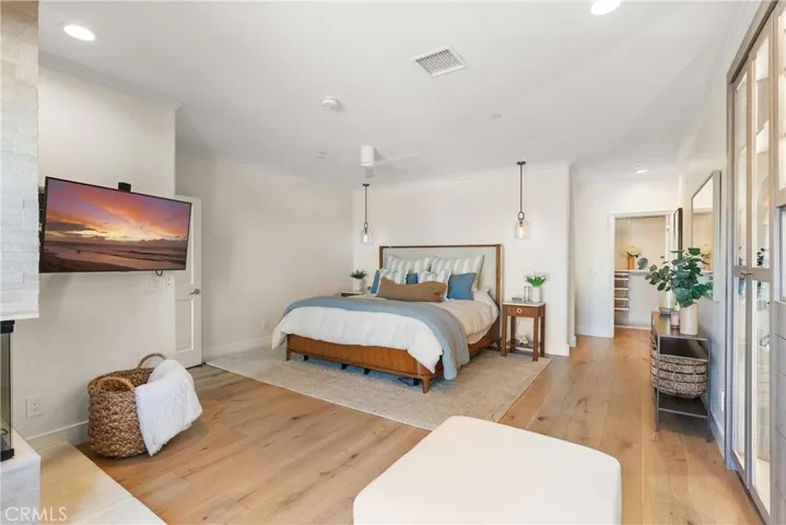 Spacious primary suite with beautiful custom wall wardrove closest, lots of cabinet space for all your things.