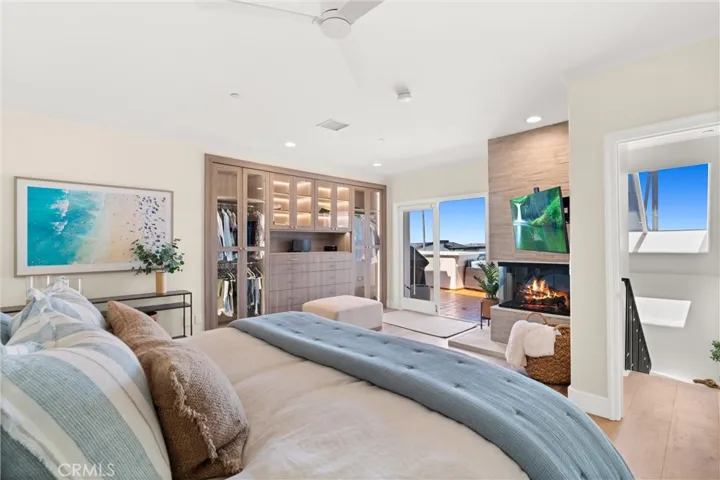 Wake up to ocean views in this resort-style bedroom with fireplace, flat-screen TV, elegant lighted wardrobe and access to the entertainer’s patio.