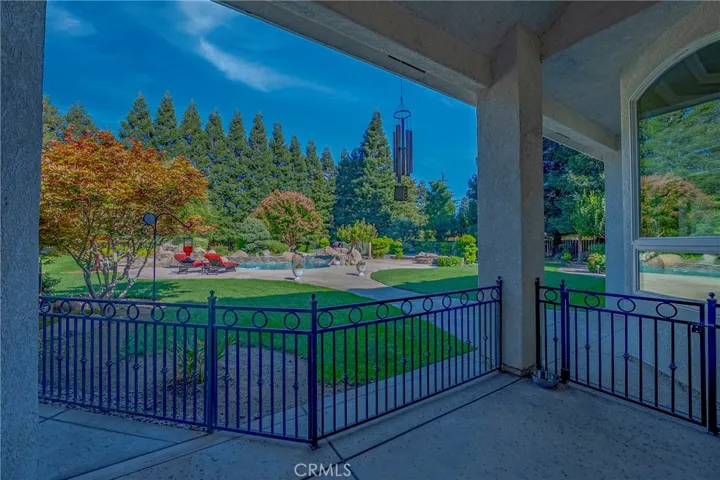 Gated area for pets that leads to side yard of grass