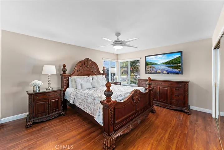Large Downstairs Primary Bedroom - Beautiful Wood flooring updated windows throughout
