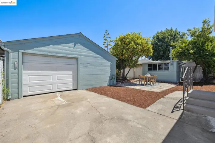 Garage featuring concrete driveway