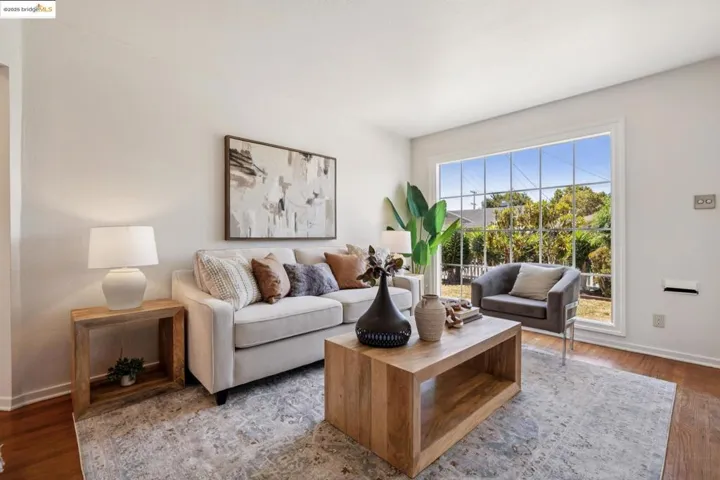 Living room with wood finished floors and baseboards