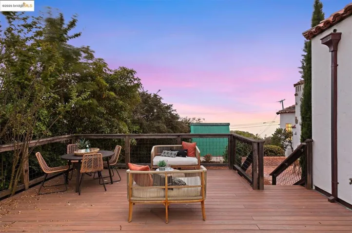 Wooden terrace featuring an outdoor hangout area