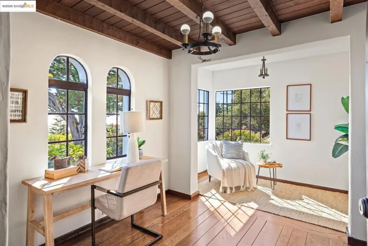 Office space with a wood ceiling with exposed beams, hardwood / wood-style flooring, and a chandelier