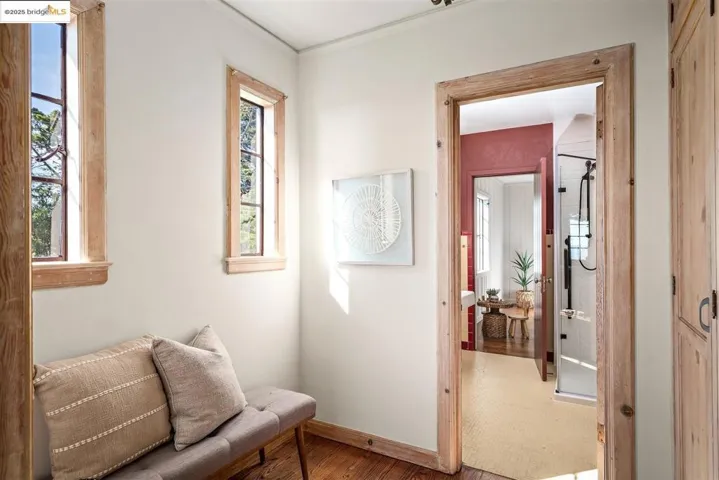 Sitting room featuring crown molding and wood finished floors