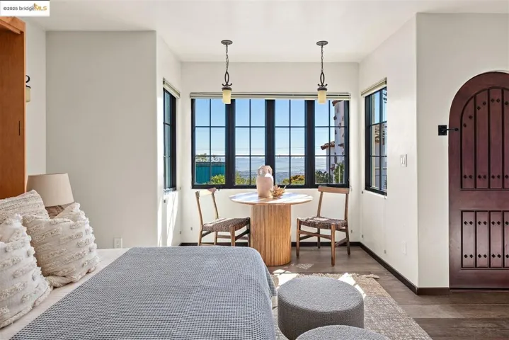 Entrance foyer featuring wood finished floors and a water view