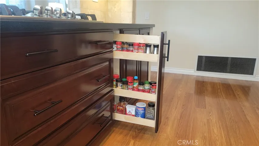 With highly coveted pull-out drawers and spice rack, you are going to LOVE this kitchen!