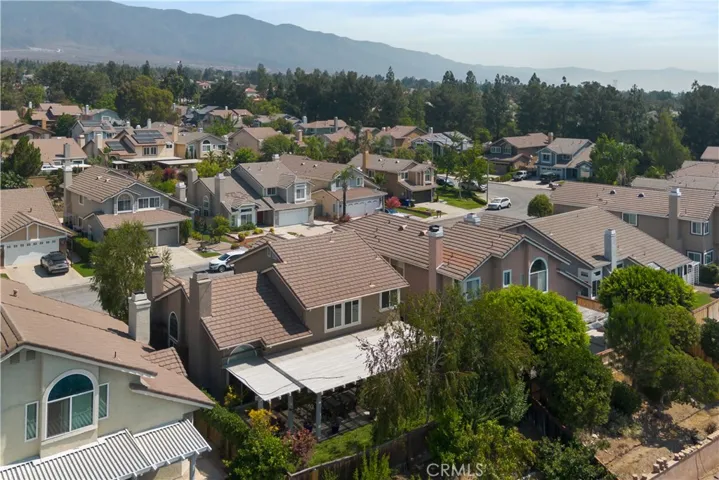 Aerial view of the backyard and home.