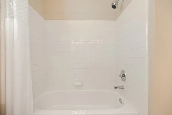 Upstairs bathroom has a shower/tub combo.