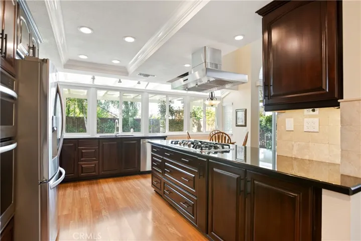 A lot of thought went into this redesigned kitchen. Can't you just imagine standing at the kitchen sink watching the hummingbirds right outside your window?
