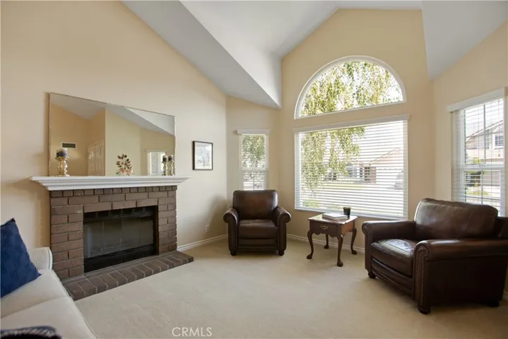 The living room is bright and open and makes a statement with beautiful architectural designs.