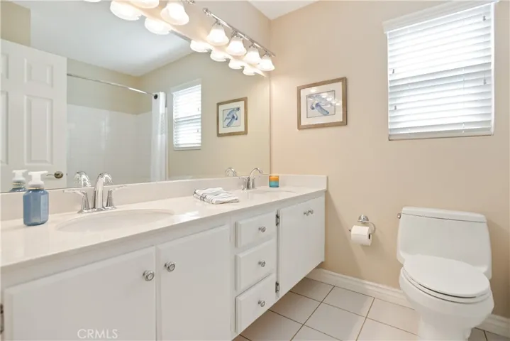 The upstairs hall bathroom has dual sinks, which is great if multiple kids are getting ready for school at the same time.