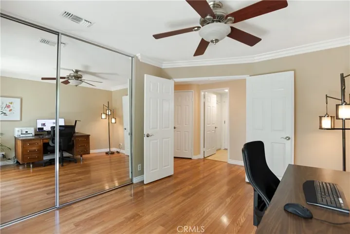 The downstairs bedroom has plenty of closet space and an impressive double-door entry.