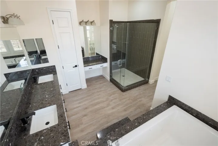 Main House - Primary Bathroom showing Walk In Shower