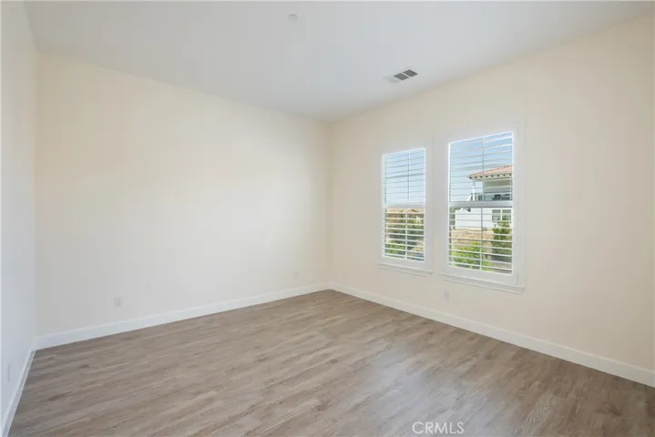 Main House - Bedroom  4 with En Suite Bathroom with view of Front yard
