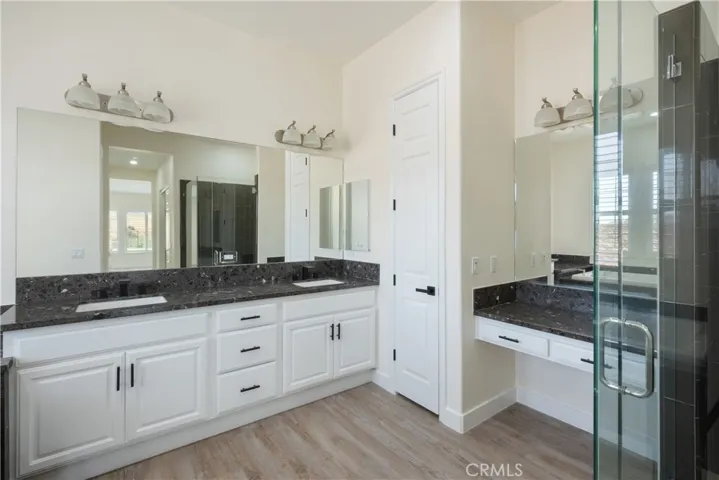 Main House - Primary Bathroom showing Dual Sinks and Vanity