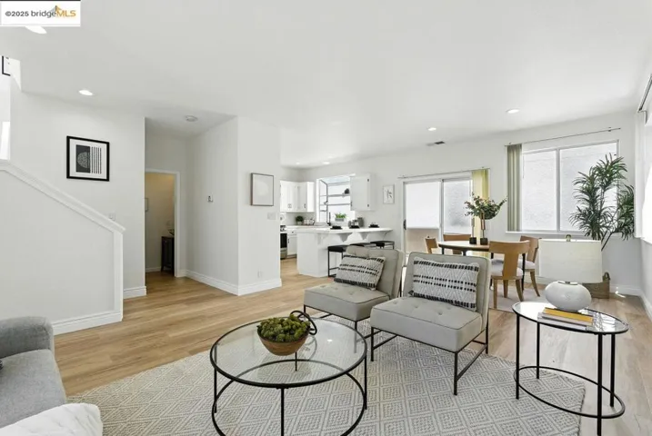 Living room with recessed lighting and light wood-type flooring