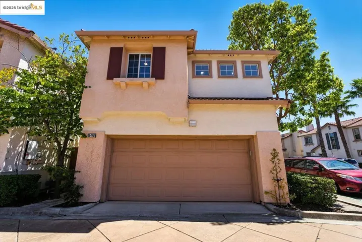 Mediterranean / spanish-style home featuring stucco siding, a garage, and concrete driveway
