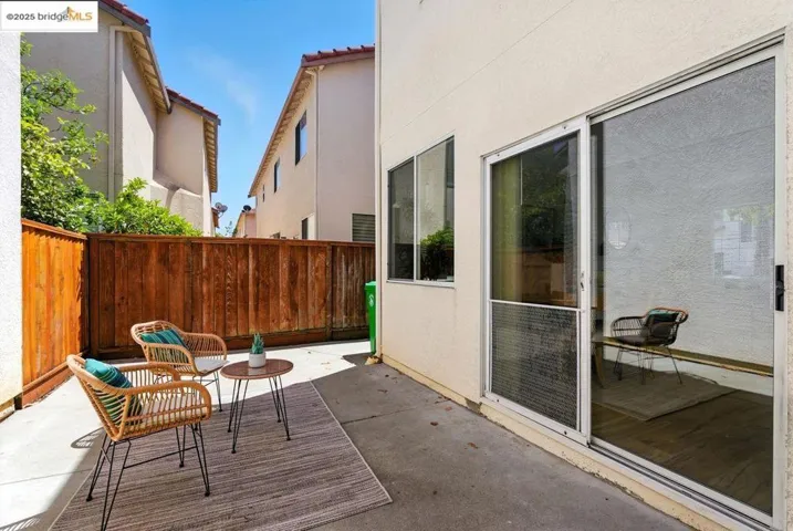 Fenced backyard featuring a patio