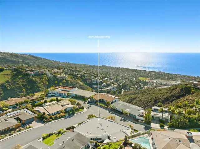 Conveniently located near Laguna's Village, renowned restaurants, galleries, and beaches, this home epitomizes coastal living in Laguna Beach.