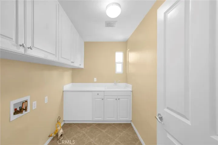 Laundry Room in between bedroom 3 & 4.