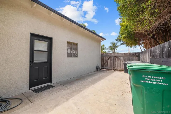 Side door to garage and Laundry Room with trailer parking or small RV