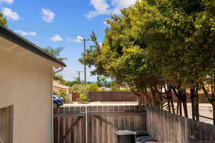 Peak-A-Boo Ocean View front yard, backyard where Trailer paring is and also Kitchen window