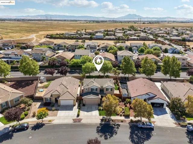 Aerial perspective of suburban area featuring mountains