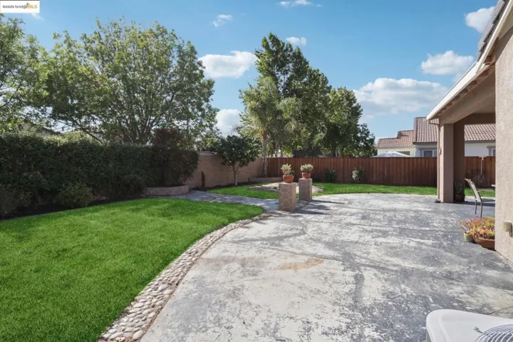 Fenced backyard featuring a patio area