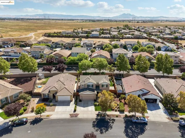 Aerial view of residential area with a mountainous background