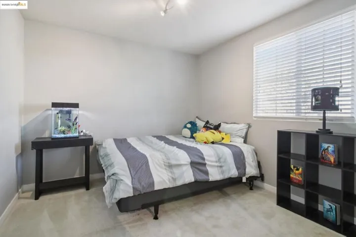 Carpeted bedroom with baseboards