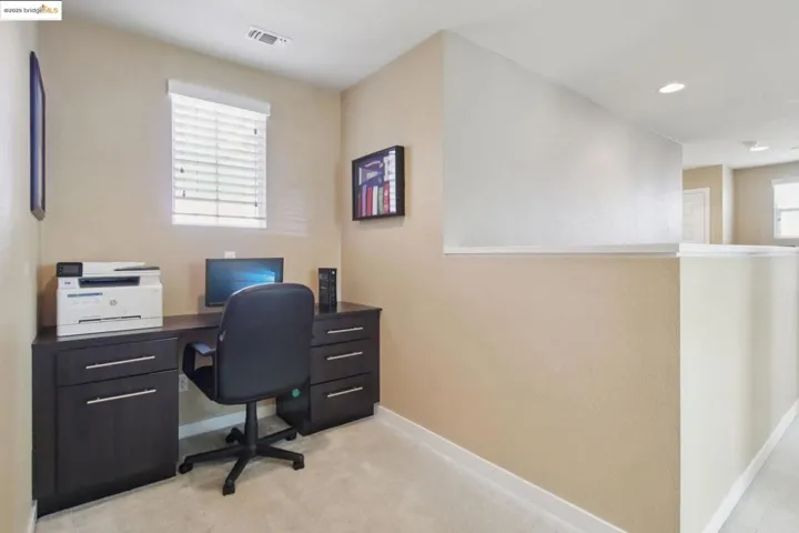 Home office featuring light carpet and recessed lighting