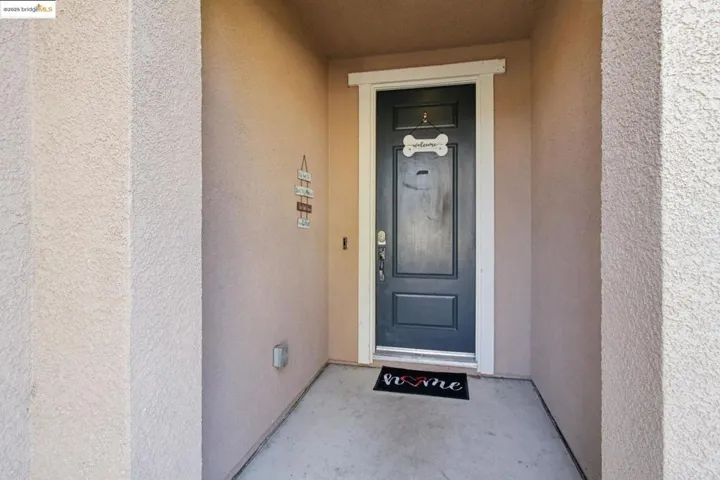 Property entrance with stucco siding