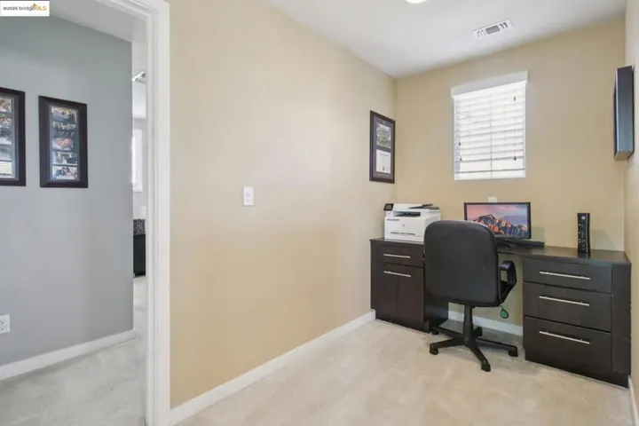 Office with light colored carpet
