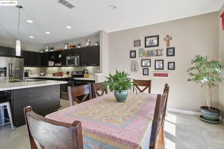 Dining room featuring recessed lighting and light tile patterned floors