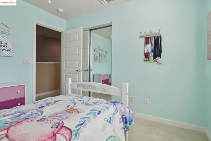 Carpeted bedroom with baseboards