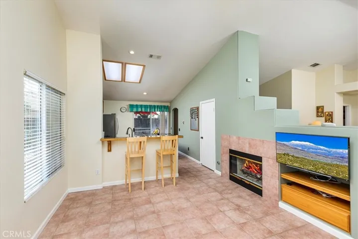 Front living area with breakfast bar. Open to kitchen